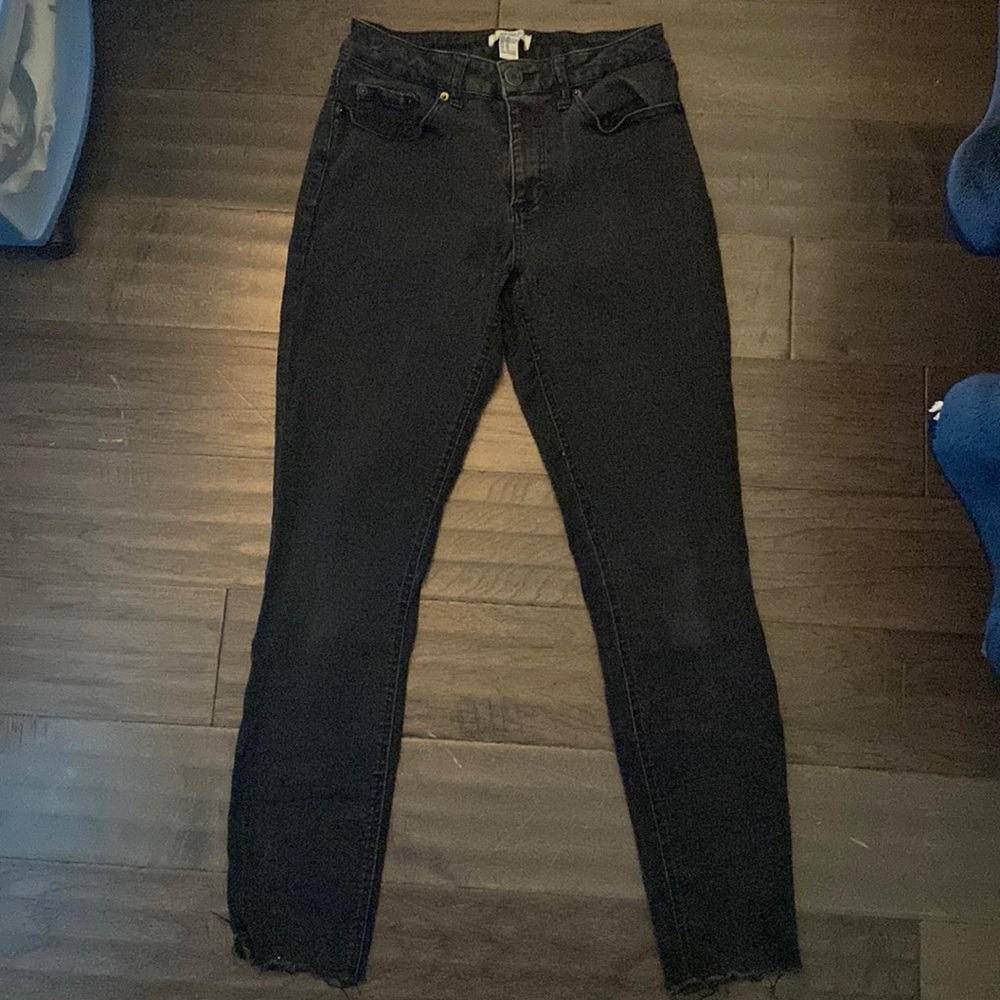 black jeans, ripped at bottom